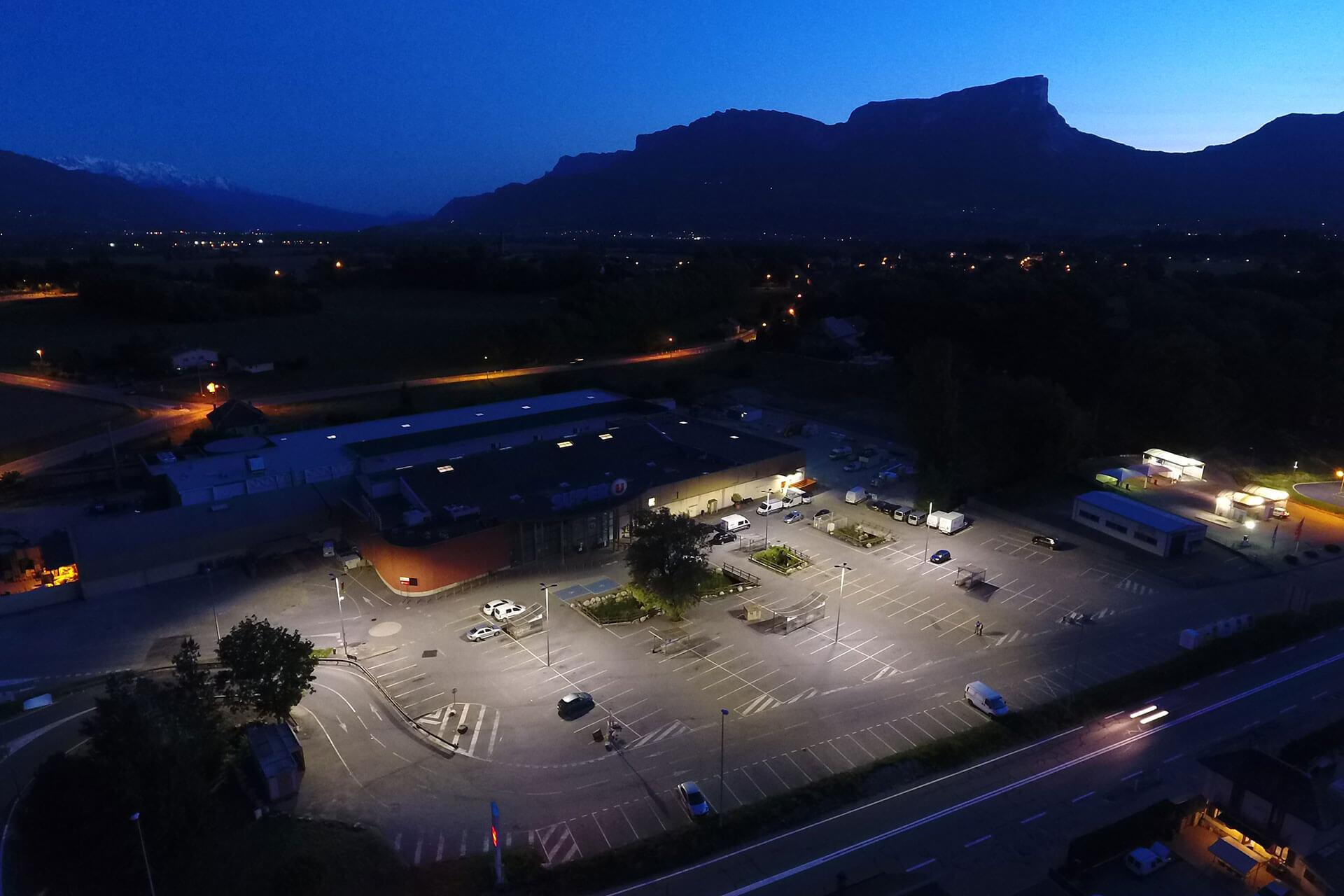 Schréder LED luminaires deliver a sustainable lighting solution, reducing any light spill, for this supermarket car park in Montmelian